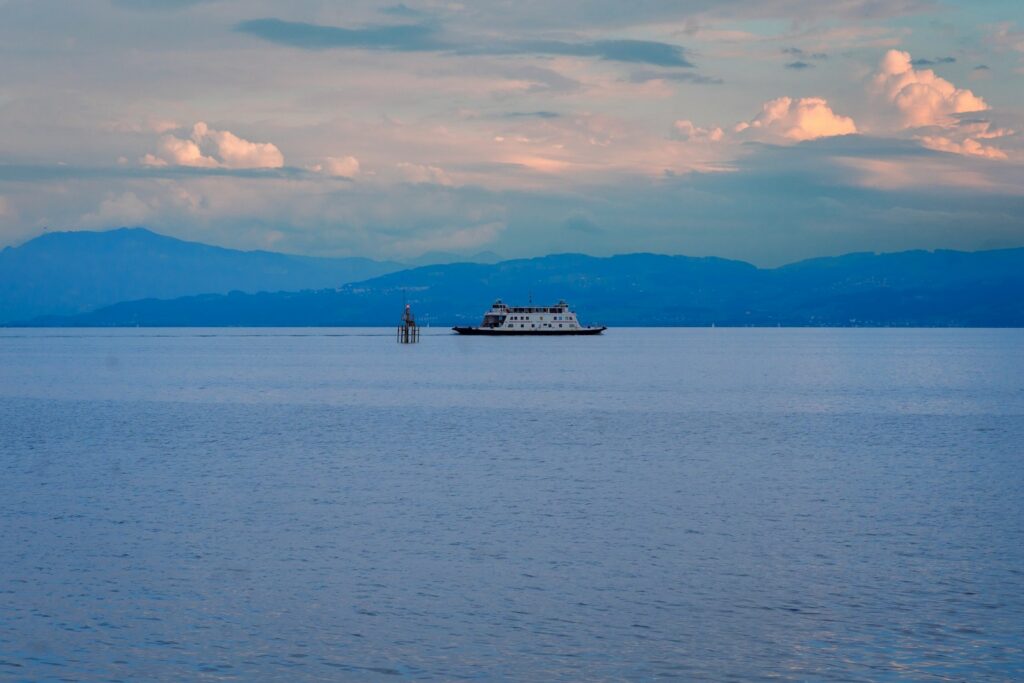 A large boat floating on top of a large body of water